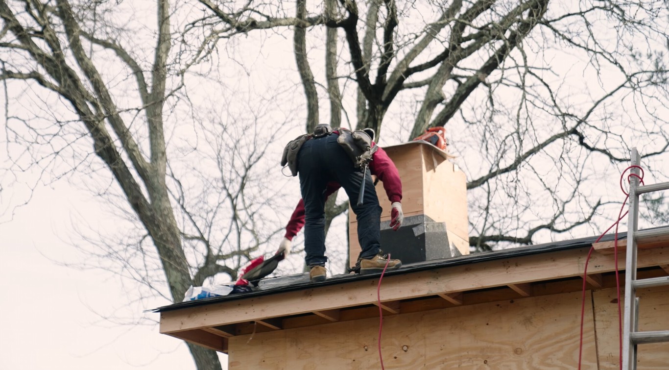 Professional sunroom construction crew installing roof structure in Waco, TX
